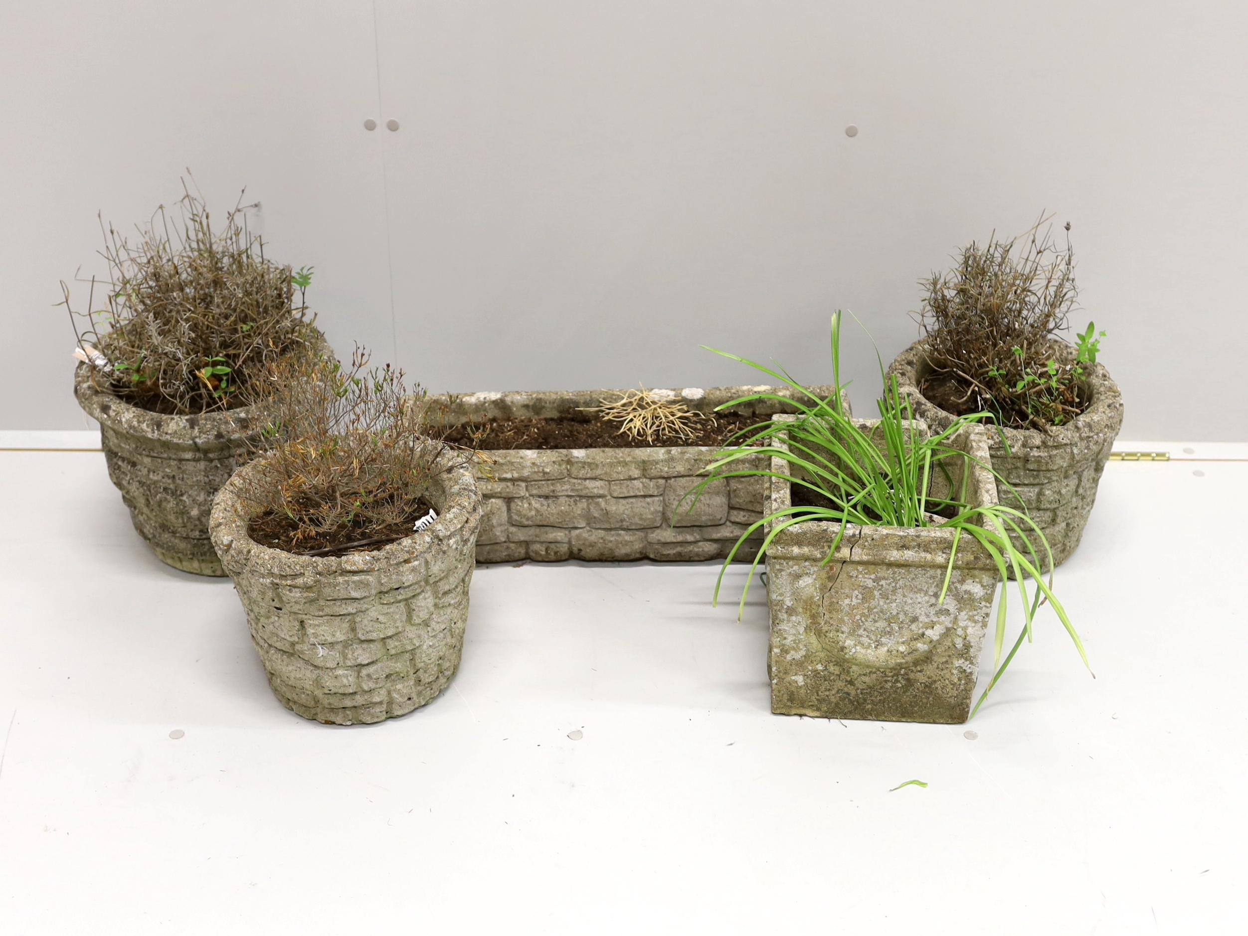 Five reconstituted stone garden planters